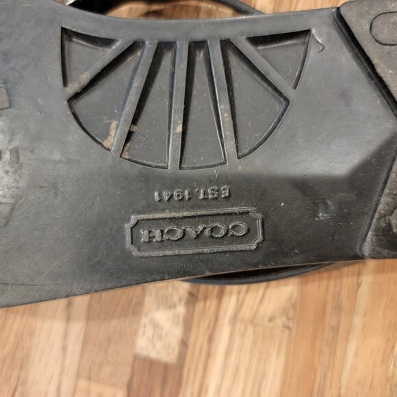 Coach Landon jelly flip flops in black with a gold bow and white pattern. - Picture 10 of 12